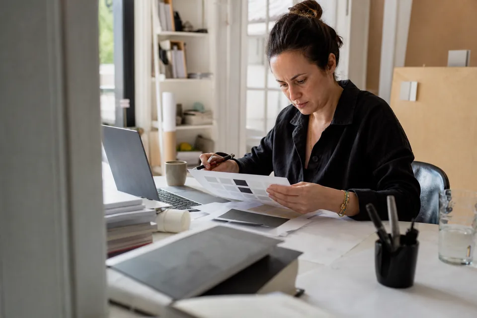 Founder reviewing a shortlist of brand names at a desk