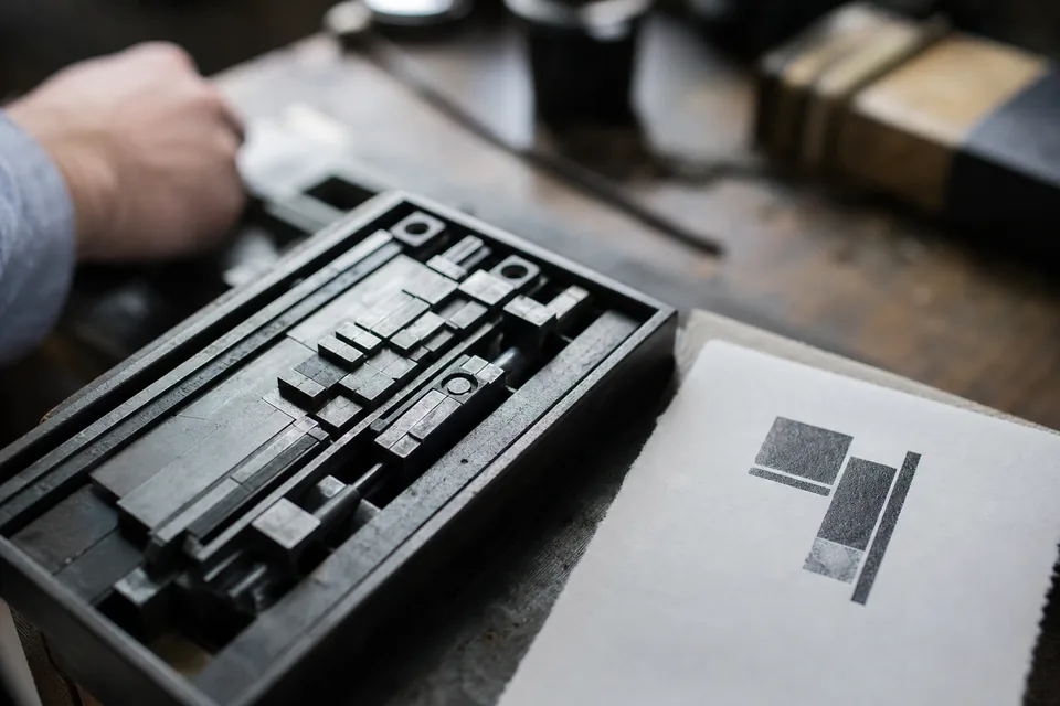 Letterpress type blocks and a printed proof
